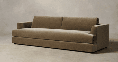 A contemporary two-seater sofa upholstered in a plush, olive green velvet or similar fabric, featuring a low-profile design, track arms, two distinct loose back cushions, and a single, long seat cushion. The sofa rests on discreet, recessed block feet, giving it a floating appearance. — 3D model