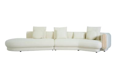 A large, curved sectional sofa upholstered in a light, textured boucle fabric, featuring a left-hand chaise extension and a unique right-hand armrest with a recessed wooden panel. The sofa includes several matching decorative pillows, both square and round. — 3D model