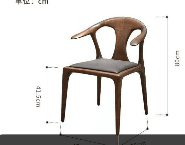 A sculptural armchair crafted from dark wood, featuring a curved backrest that seamlessly flows into integrated armrests. The chair has a dark gray upholstered seat and is supported by four tapered legs. Its design exhibits organic curves and a minimalist aesthetic. — 3D model