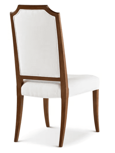 A single upholstered dining chair with a tall, slightly curved backrest. The chair features a wooden frame with visible grain. The seat and backrest are upholstered in a light-colored, textured fabric, trimmed with a contrasting welt cord. The legs are slender and tapered. — 3D model