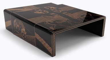 A low, rectangular coffee table featuring a waterfall design, where the top and sides are seamlessly curved. It has a glossy black lacquered finish adorned with intricate gold-colored decorative etchings or inlays depicting stylized ancient figures and winged creatures on its surfaces. — 3D model