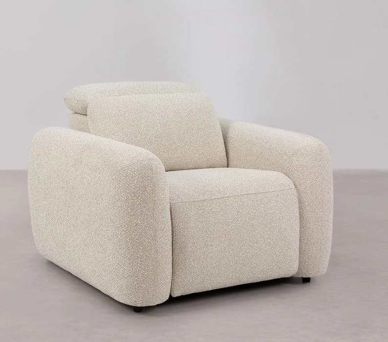 A modern armchair with a plush, upholstered design. It features rounded arms and a generously padded seat and backrest, suggesting comfort and contemporary style. The fabric has a textured, bouclé-like weave. — 3D model
