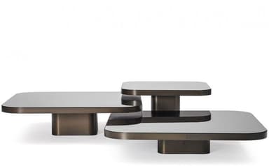 A modern multi-tiered coffee table featuring three distinct rectangular platforms with rounded corners. Each platform has a white top surface and dark bronze-toned edges and a low, rectangular base. The platforms are arranged in an overlapping, offset configuration, suggesting a potential swivel or modular adjustment capability. — 3D model