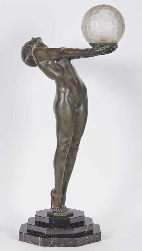 An Art Deco bronze sculpture of a nude female figure in an arched pose, holding aloft a spherical, frosted, faceted glass light shade, all mounted on a multi-tiered black marble base. — 3D model