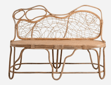 A two-seater bench constructed entirely from rattan. The design features a woven seat and a backrest with an intricate, open-weave pattern creating a somewhat organic, cloud-like shape. The frame and legs are made of bent rattan poles, with curved elements and supports for both stability and aesthetic appeal. The overall construction suggests a lightweight yet sturdy piece. — 3D model