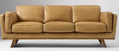 A three-seater sofa with a low profile and square arms. The sofa features upholstered cushions for the back and seat, with piping detail along the edges. It is supported by a wooden frame with tapered legs. — 3D model