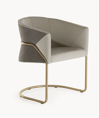 An elegant contemporary accent armchair featuring two-tone upholstery and a sleek metal frame. The chair has a gently curved backrest that seamlessly integrates into the armrests. The main seating and inner back are upholstered in a light, neutral material, while the outer back and side panels feature a contrasting darker, textured material. The chair is supported by an open, slender metal frame with a U-shaped front base and a continuous curved back support, all finished in a polished brass or gold tone. — 3D model