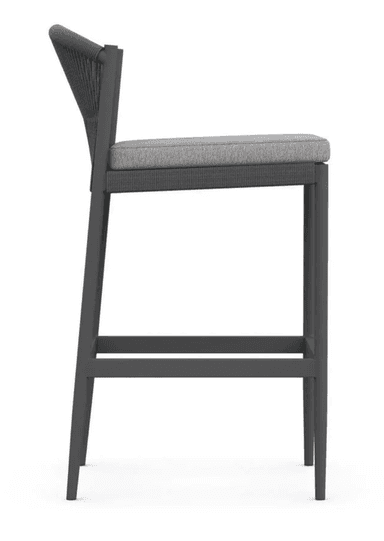 A contemporary bar stool featuring a dark grey aluminum frame, a backrest crafted from tightly woven dark grey rope, and a light grey upholstered seat cushion. It includes an integrated footrest. — 3D model