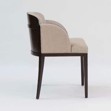 An elegant armchair featuring full beige linen-blend upholstery on the seat, backrest, and integrated armrests. The chair has a sturdy dark-stained wood frame that forms the legs and is partially exposed along the backrest. The legs are straight and tapered, complementing the contemporary design. — 3D model
