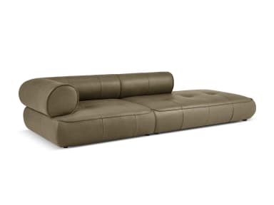 A modern chaise lounge sofa with a tufted seat cushion and a rounded armrest/headrest. The sofa features clean lines and a low profile, upholstered in a smooth, matte-finish material. — 3D model