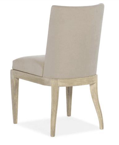 A contemporary dining chair with a neutral-toned upholstered seat and back, supported by a light-colored wooden frame. The chair features a straight, high backrest and tapered legs, with the front legs exhibiting a slight curve. — 3D model