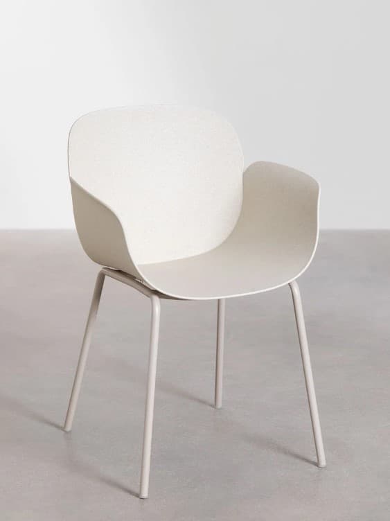 A modern armchair with a molded seat and backrest supported by four slender, tapered metal legs. The seat and back appear to be a single, seamless piece with subtle texturing on the surface. The armrests are integrated into the curved backrest. — 3D model