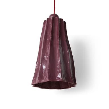 A dark purplish-plum pendant light with a distinct, irregularly pleated or fluted ceramic shade, suspended by a bright red textile cord. The shade is wider at the bottom and tapers slightly towards the top, where a small spherical finial integrates the fixture with the hanging cord. — 3D model