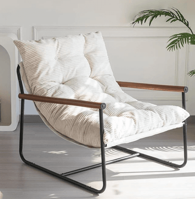 A contemporary lounge chair featuring a minimalist black metal frame, wooden armrest sleeves, and a generously padded, button-tufted off-white corduroy cushion. The design emphasizes comfort and a relaxed posture, blending industrial elements with soft, inviting upholstery. — 3D model