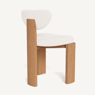 A modern chair with a distinct design featuring a wooden frame and a cushioned seat and backrest. The frame has a blocky, geometric construction with thick, upright legs and a similarly structured seat support. The backrest is curved and upholstered. The visible wood grain suggests a natural finish. — 3D model
