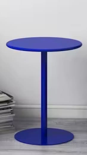 A modern side table with a circular tabletop and a single pedestal base, also circular. The table has a minimalist design and is finished in a solid matte blue color. — 3D model