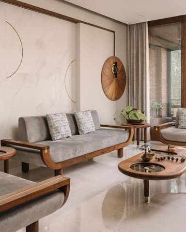 A contemporary two-seater loveseat with an exposed curved wooden frame, upholstered in grey fabric, and accented with brass inlays. — 3D model