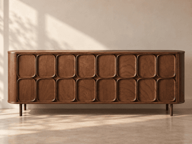 A long, low, rectangular wooden credenza or sideboard with rounded corners and a distinctive front design. The front features a series of multiple recessed, rounded-edge rectangular panels, arranged in two rows, which likely function as door or drawer fronts. The side panels have vertical fluting. The piece is supported by four slender, cylindrical legs. The wood has a dark, rich finish. — 3D model
