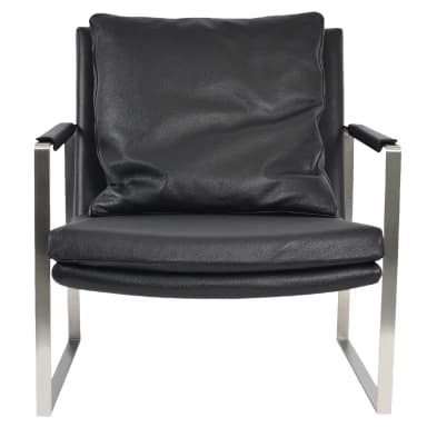 A contemporary lounge chair featuring a minimalist open-cube frame constructed from polished or brushed metal, likely stainless steel or chrome. The chair is upholstered with thick, black leather cushions for the seat and back, and includes an additional smaller, rectangular lumbar pillow. The armrests are integrated into the metal frame and feature black leather pads for comfort. The design emphasizes clean lines and a low-profile aesthetic. — 3D model