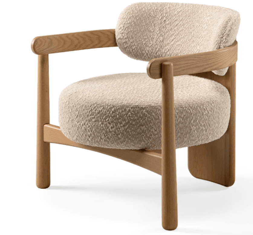 A modern armchair featuring a light-colored wooden frame with rounded edges and thick, plush, off-white boucle upholstery. The design is minimalist with exposed wood elements. — 3D model