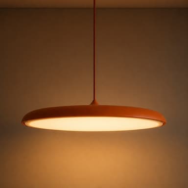 A modern, minimalist white disc-shaped pendant light suspended from a ceiling rod. It features an integrated light source providing downward illumination through a wide diffuser. — 3D model