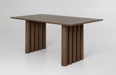 A contemporary rectangular dining table featuring a dark wood finish and distinctive fluted pedestal bases. The tabletop appears to be constructed from two panels, joined at the center, resting atop two substantial cylindrical bases composed of vertical fluted elements. The overall aesthetic is minimalist yet refined. — 3D model