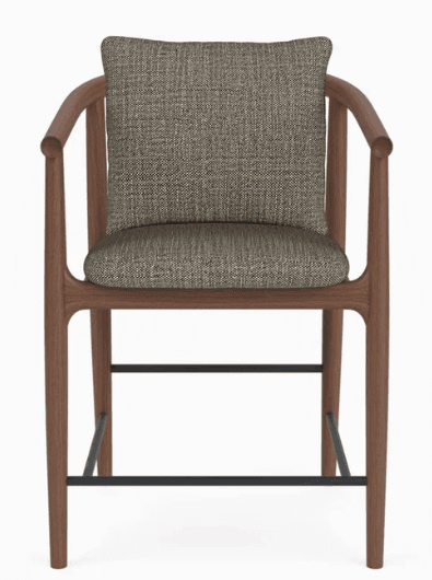 A contemporary bar stool with a wooden frame and upholstered seat and back cushion. The frame features curved armrests that extend from the back legs. The seat and back are upholstered in a textured fabric. Two dark metal crossbars are integrated into the lower section of the legs for stability. — 3D model