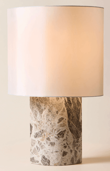 A contemporary table lamp featuring a cylindrical marble base with intricate natural patterns and a simple, light-colored fabric drum shade. — 3D model