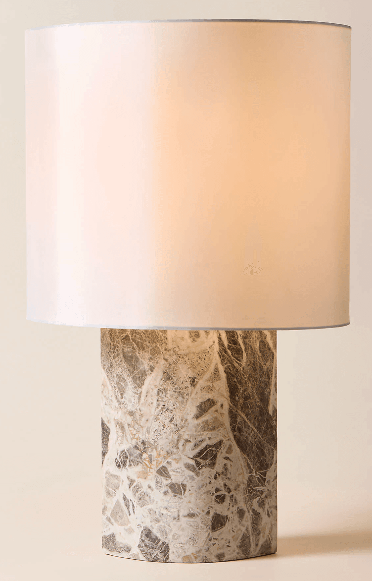 A contemporary table lamp featuring a cylindrical marble base with intricate natural patterns and a simple, light-colored fabric drum shade. — 3D model