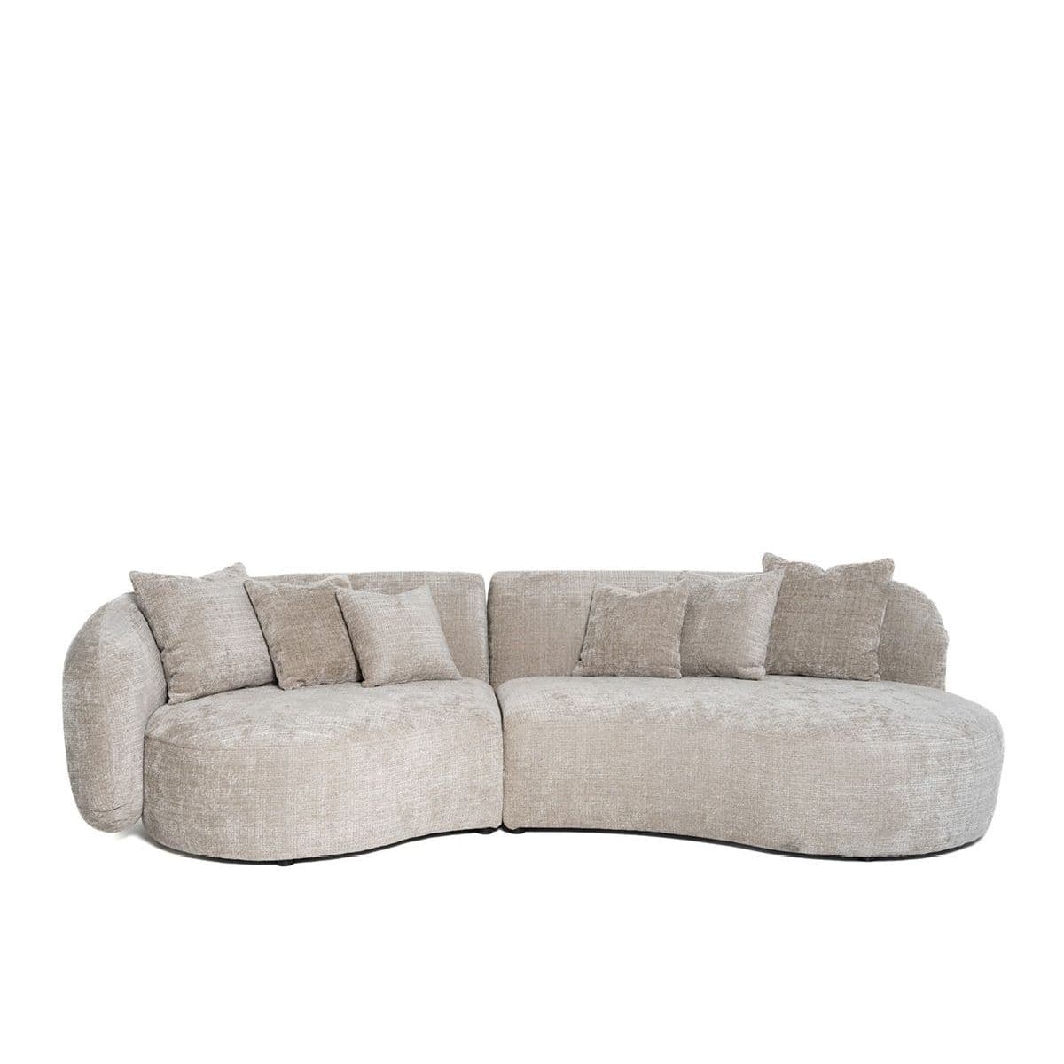 A modern, curved sectional sofa with rounded arms and a low profile. The sofa features a textured, light-colored upholstery and comes with several matching throw pillows. — 3D model