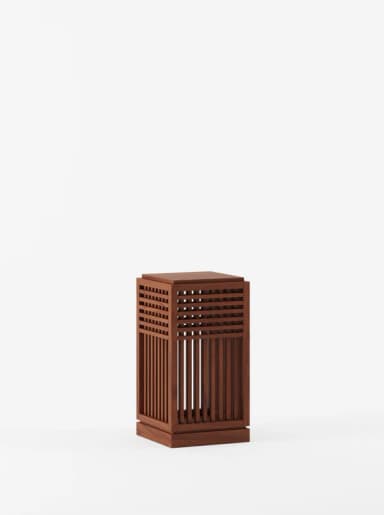 A rectangular wooden end table with a slatted design on its front panel. The slatted design consists of vertical slats and horizontal crossbars creating a grid pattern. The top surface is flat and solid. — 3D model