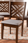 A wooden dining chair featuring a rich brown finish, an intricately designed lattice backrest, and a light-colored upholstered seat cushion. The chair has straight, tapered legs and a sturdy construction. — 3D model