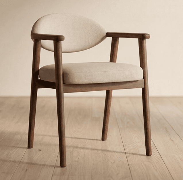 A modern armchair featuring a dark wood frame and light-colored upholstered seat and back. The backrest is rounded, and the armrests are integrated into the wooden frame, providing a sleek and comfortable design. — 3D model