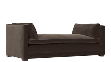 A low-profile upholstered daybed with a rectangular seat cushion and two scatter cushions placed against the high, padded armrests. The daybed features a continuous upholstered base and appears to be covered in a soft velvet fabric. — 3D model