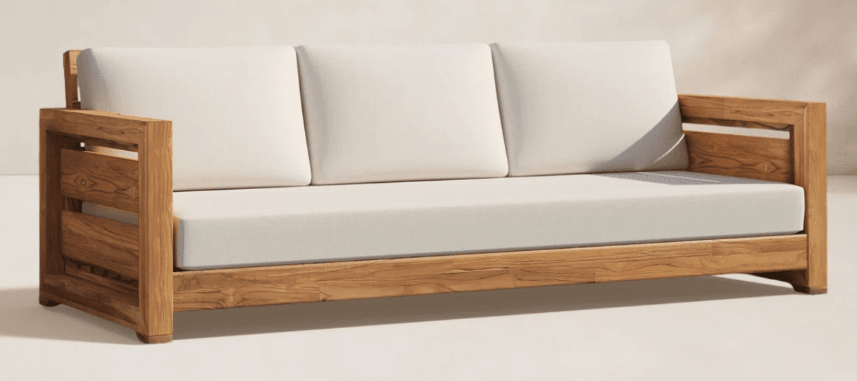A contemporary three-seater outdoor sofa featuring a sturdy teak wood frame and three plush, off-white upholstered cushions for both the seat and backrest. The frame has a slatted design on the armrests and visible wood grain, indicating natural material and construction suitable for outdoor use. — 3D model