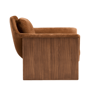 A contemporary armchair with a rounded, upholstered seat and backrest, featuring a detached lumbar cushion. The frame is constructed with solid wood panels that form substantial, block-like legs and armrests. The wood grain is prominently displayed, and the upholstery has a soft, velvety texture. — 3D model