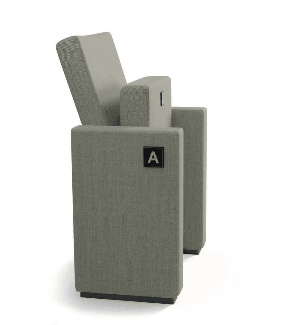 A single upholstered auditorium chair, presented from a side perspective. It features gray textured fabric on the seat, backrest, and armrests. The seat is in an upright, unoccupied position, suggesting a folding mechanism. A black rectangular label with a white letter 'A' is affixed to the outer side of the armrest, indicating its likely use in a numbered or lettered seating arrangement. — 3D model