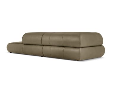 A modern chaise lounge sofa with a tufted seat cushion and a rounded armrest/headrest. The sofa features clean lines and a low profile, upholstered in a smooth, matte-finish material. — 3D model