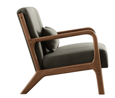 A modern armchair with a wooden frame and upholstered seat and backrest. The frame has a natural wood finish and features curved armrests and angled legs. A small, matching upholstered pillow is placed against the backrest for added comfort. The upholstery appears to be a textured fabric. — 3D model