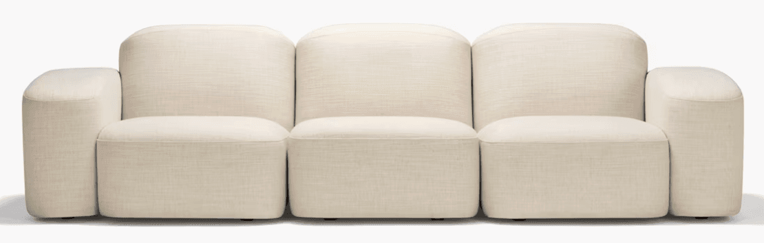 A three-seater sofa with a modular design, featuring rounded arms and backrests. The upholstery has a visible textured weave. The seat cushions are separate from the base, and the overall form is soft and organic. — 3D model