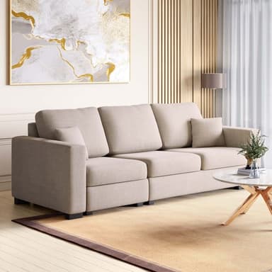 A modern three-seater modular sofa upholstered in a light beige fabric. It features three individual seat cushions and three back cushions, along with two small accent pillows. The sofa has clean lines with wide, square track arms and low-profile black block feet. The design suggests a contemporary or minimalist aesthetic, offering a comfortable and adaptable seating solution. — 3D model