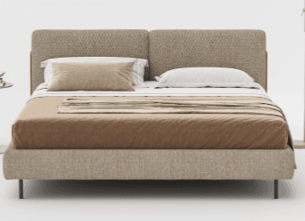 A modern upholstered bed frame with a horizontally segmented headboard. The bed is dressed with linens including a fitted sheet, duvet, and accent pillows. The frame is supported by slim, dark-colored legs. A small side table with books is visible to the left. — 3D model