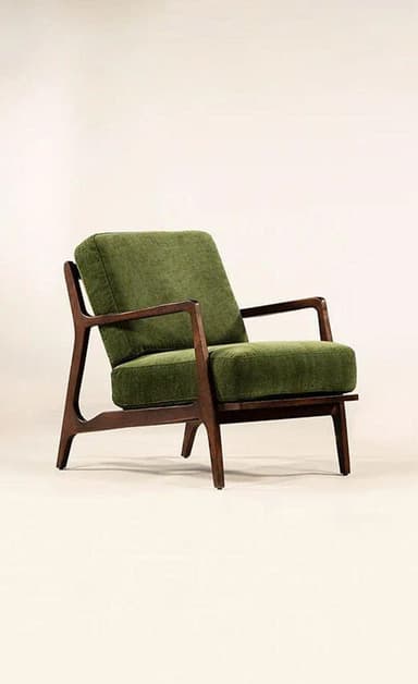 A contemporary lounge chair featuring an exposed dark wood frame and plush, upholstered green cushions. The design has a mid-century modern aesthetic with clean lines and angled elements. — 3D model