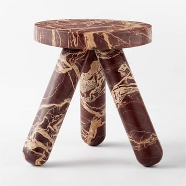 A round side table with a thick, beveled edge top. The table is constructed entirely from marble, featuring a rich burgundy base color with striking white and tan veining throughout the surface and base. The visible base suggests a pedestal or column design. — 3D model