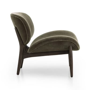A contemporary armchair with a distinctive organic shape, featuring a high, enveloping backrest and a curved, molded seat and armrest. The chair is supported by a wooden base with four splayed legs. — 3D model