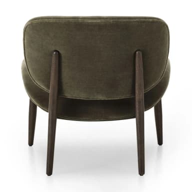 A contemporary armchair with a distinctive organic shape, featuring a high, enveloping backrest and a curved, molded seat and armrest. The chair is supported by a wooden base with four splayed legs. — 3D model