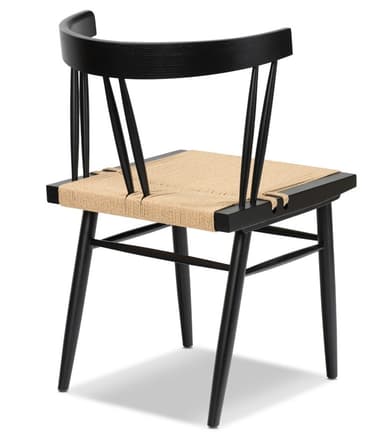 A modern dining chair featuring a matte black wooden frame and a natural woven rush seat. It has a spindle backrest with a curved top rail and tapered legs connected by stretchers. — 3D model