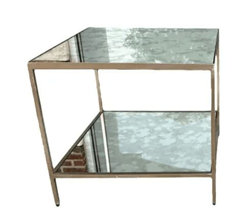 A rectangular two-tiered table featuring an antiqued brass-tone metal frame and two mirrored shelves with a distressed finish. — 3D model