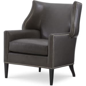 A dark brown accent chair upholstered in leather, featuring a high back with subtle wingback elements. The edges of the chair are adorned with decorative brass nailhead trim. The chair has four tapered legs made of dark wood. — 3D model