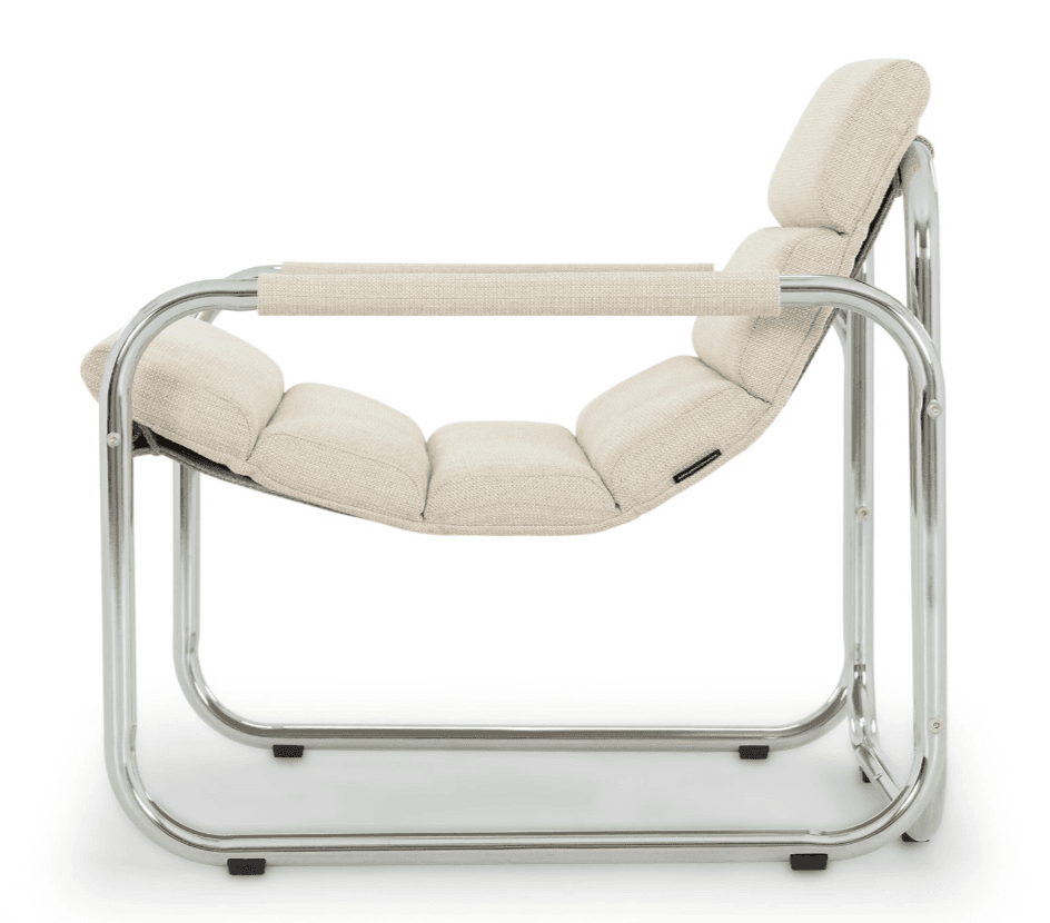 A low-profile armchair with a tubular chrome-plated steel frame. The seat and backrest are upholstered with a textured, light beige fabric, featuring a segmented design for comfort. The armrests are also upholstered with the same fabric, integrated into the frame. — 3D model